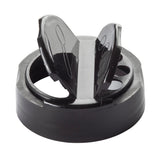 A close-up of a black plastic replacement shaker top with two raised flaps for pouring. The glossy circular lid features curved openings and an outer rim that snaps onto a container. The flaps form a V-shape in this TableCraft 10325 design.