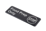 A rectangular black self adhesive sign with white text reads Food Prep Only. An outlined octagon near the bottom right has the word STOP inside, resembling a stop sign, warning that this area is for food preparation only.