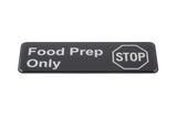 A self adhesive rectangular black sign with white text reads “Food Prep Only.” To the right, there’s an outline of a stop sign with “STOP” inside, both in white. The sign has rounded corners and a glossy finish.