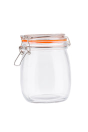A clear, empty resealable glass canister with a round body and an orange rubber seal. Featuring a clip-top lid with a hinged metal clasp for airtight storage, the jar stands out against the plain white background.