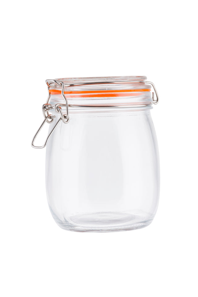 A clear, empty resealable glass canister with a round body and an orange rubber seal. Featuring a clip-top lid with a hinged metal clasp for airtight storage, the jar stands out against the plain white background.