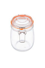 A transparent glass resealable canister with a round shape, an orange silicone seal around the clip-top lid, and a metal clasp closure at the front. The empty jar is set against a white background.
