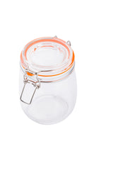 A clear glass canister with a round body and a clip-top lid. The lid features an orange rubber seal and metal clasp for secure closure. This resealable glass canister is empty and set against a white background.