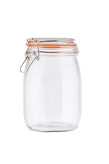 A clear, empty resealable glass canister with a hinged metal clasp and an orange rubber seal on the clip-top lid, shown against a plain white background. The jar stands upright and fully closed, with its clasp mechanism on the left side.