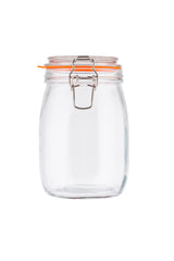 A clear resealable glass canister with a wide mouth sits against a white background. The jar features a metal clasp and clip-top lid with an orange rubber seal for an airtight closure. Its rounded shape and flat base make it both practical and stylish.