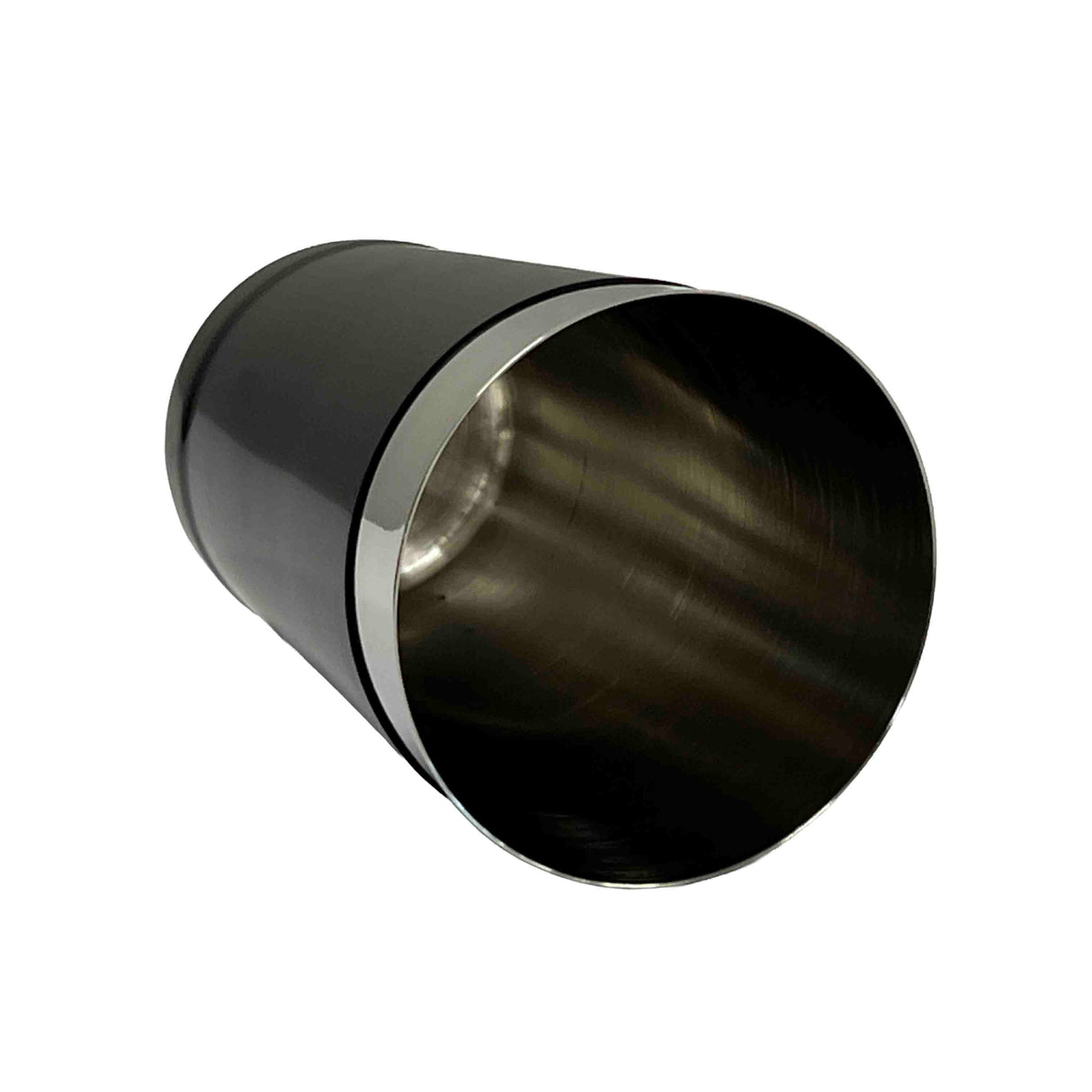 A 16 oz stainless steel cup or bar shaker lies on its side against a plain white background. The cup has a shiny, metallic finish, a wide opening, and smooth edges. The inner surface is visible, reflecting light.