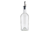 A clear glass Oil & Vinegar Bottle with a stainless steel pourer and black collar stands upright on a white background. Its base features a slight indentation, and the metal spout has a small cap attached for closing.