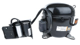 An Empura Refrigeration compressor, model E-EGM-23FB, with attached capacitors and wiring sits on a white background. The cylindrical unit features metal mounting brackets, a visible label, and a separate black bracketed capacitor housing.