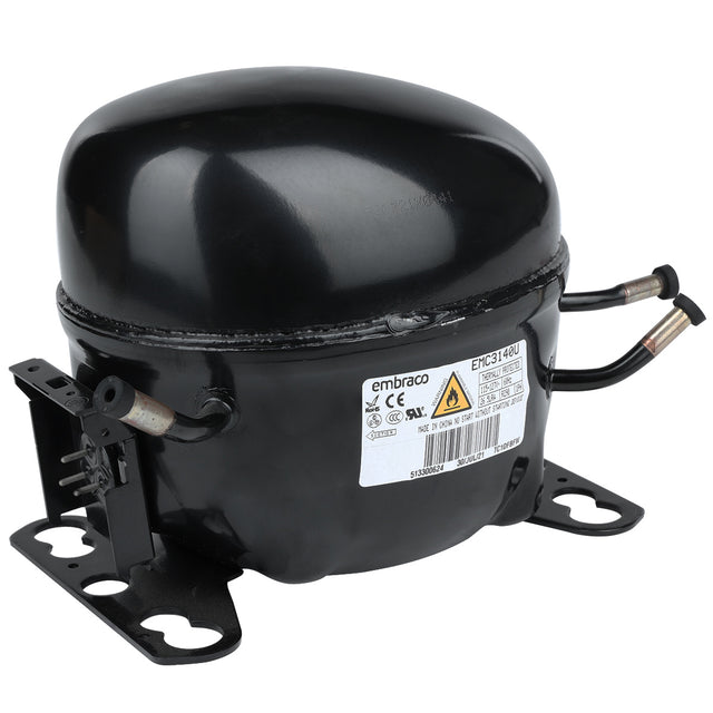 A black, oval-shaped Embraco E-EGM-16FB compressor for Empura Refrigeration, featuring a white label, metal mounting brackets, and two copper tubing pipes. The unit sits on a white background with warning and certification symbols displayed.
