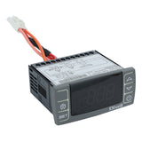 A digital temperature controller by Dixell, ideal for Empura Refrigeration, features a dark display screen, rectangular black and gray body, side ventilation slots, labeled front buttons, and attached wires with a white connector. Technical label is visible on top.