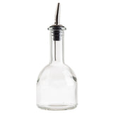 A clear glass 10 oz oil & vinegar bottle with a round base and narrow neck, topped with a stainless steel pourer. The spout features a black rubber stopper at its base. The empty bottle is set against a white background.