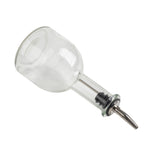 A 10 oz clear oil & vinegar bottle with a narrow neck lies on its side, featuring a stainless steel pourer and rubber stopper at the opening. Ideal for pouring liquids, it rests against a plain white background.