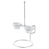 A stainless steel stand with a circular base holds two small white bowls as ramekin holders. Set at different heights, the bowls rest in metal rings, while a tall rod with a ball top adds stability and modern style—perfect as an onion ring tower for serving.