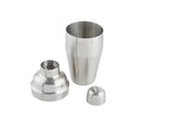 An 18 oz stainless steel cocktail shaker is shown disassembled into three parts: the main cup standing upright, the built-in strainer lid beside it, and the small cap lying nearby, all on a plain white background.