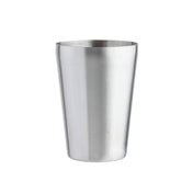 An 18 oz stainless steel cocktail shaker stands upright on a white background. The cylindrical shaker features a slightly wider opening at the top and a brushed metal finish, highlighting its smooth, reflective surface.