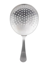 A TableCraft stainless steel skimmer spoon with a round, flat, perforated head and long handle. The smooth, brushed metal finish and evenly spaced holes make it ideal for draining liquids. Photographed on a white background.