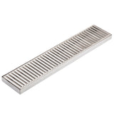 A rectangular TableCraft stainless steel floor drain cover with parallel, evenly spaced slats and a solid metal frame. Its smooth, shiny surface resembles a drip tray, allowing water to pass through while blocking larger debris.