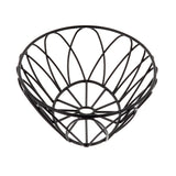A black metal oval serving basket from the TableCraft Petal Collection, featuring an open, geometric design with curved wires forming a wide, bowl-like shape that resembles overlapping petals. The empty basket is photographed on a white background.
