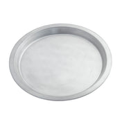 A round, shallow aluminum pie pan with a slightly raised rim sits on a white background. The pie pan features a smooth, unadorned surface and showcases a simple, utilitarian design.