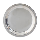A round, shiny stainless steel pie pan by TableCraft is viewed from above on a white background. The plate has a wide, slightly raised rim and a flat central surface that reflects light, giving it a smooth, polished appearance. The plate is empty.