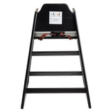 A stackable black wood high chair with a brown safety strap across the seat. A warning label with icons and text is on the backrest. The chair features four rungs and is photographed against a white background.