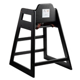 A stackable black wood restaurant-style high chair featuring an open-frame design, safety strap, and warning label on the backrest. Angled for stability, it's perfect for seating young children at tables.