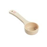 A beige polycarbonate measuring cup with a handle, marked “2 oz” and “60 ml” in red lettering. The Spoonout cup is empty and isolated on a white background. The handle has a hole at the end, likely for hanging storage.