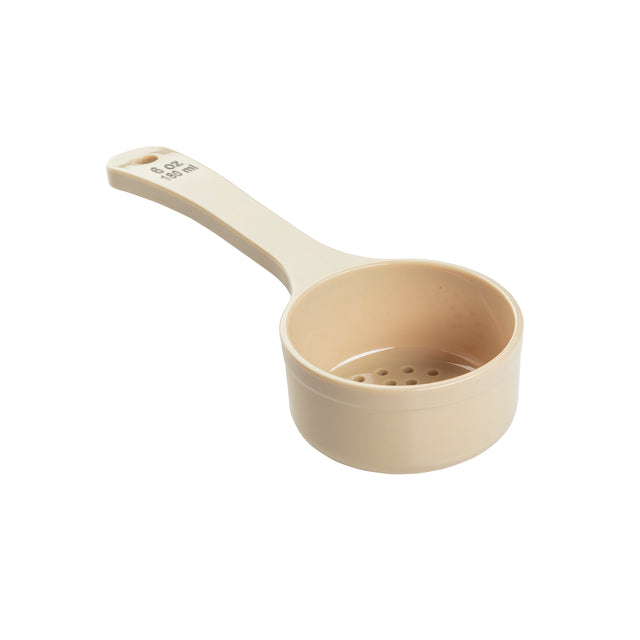 A beige polycarbonate measuring cup with a handle labeled “8 OZ 237 mL” in raised letters. The cup features small holes at the bottom, like a perforated Spoonout, ideal for draining liquids. The background is plain white.