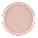 A round, light pink Serving Camtray with a smooth, flat center and a slightly raised rim. Made of durable fiberglass and featuring a matte finish, this NSF-approved tray is ideal for everyday use. The background is plain white.