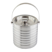 A shiny, cylindrical stainless steel ice bucket with a double wall for insulation, featuring a ribbed, horizontal stripe design, a matching metal lid with a knob handle, and an arched carrying handle attached near the rim.