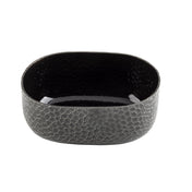 A black aluminum oval bowl with a crackle pattern and powder coat finish. Its rounded edges and mosaic exterior contrast with the smooth, glossy interior, which reflects light beautifully against the plain white background.
