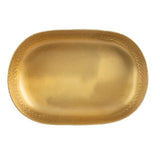 An aluminum oval bowl finished with a gold powder coat, featuring a slightly raised and ornate textured border, viewed from above against a white background. The smooth, shiny surface beautifully reflects light.