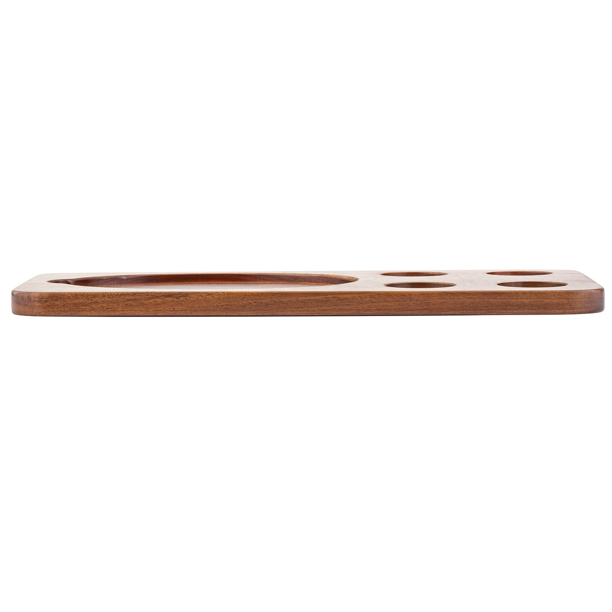 A rectangular, flat acacia wood serving board with five round indented sections of various sizes. Made from medium-brown polished wood, it’s shown from the side with a thin profile and smooth edges. The largest indentation is on the left.