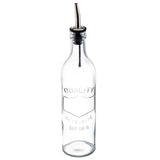 A clear glass Oil Bottle with a stainless steel pourer and black rubber top. Embossed with "QUALITY GLASSWARE EST 1875," it stands upright on a white background and appears empty.