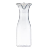 A clear 19 oz polycarbonate carafe with a wide base, narrow neck, and slightly flared rim. The carafe features a plastic lid and stands empty on a plain white background.