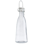 A clear, empty glass carafe with a narrow neck, curved body, and a metal swing-top closure with a white ceramic stopper. The 34 oz carafe stands upright on a white background, and the metal clasp is fastened over the top.