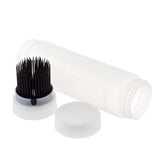 A transparent cylindrical plastic container with a white screw-on lid, one removed and lying nearby. Inside the open squeeze bottle, a cluster of thin black bristles is attached to the lid, resembling a cleaning or applicator brush.