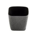 A square, aluminum Snack Basket with a black powder coated finish, featuring a wide opening and an interlocking, irregular polygon pattern. The smooth, dark interior contrasts with the textured geometric exterior against a white background.