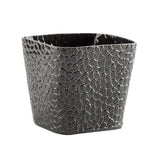 A black, glossy, square-shaped ceramic planter with a slightly flared top features a raised, geometric, pebble-like pattern that creates a textured mosaic effect—reminiscent of a stylish snack basket with its intricate design. The interior is smooth and dark.