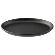 A round, flat, black TableCraft Sizzle Platter with a slightly raised rim, made of matte cast iron, sits empty on a plain white background. Its minimalist, modern design makes it perfect for stylish serving.