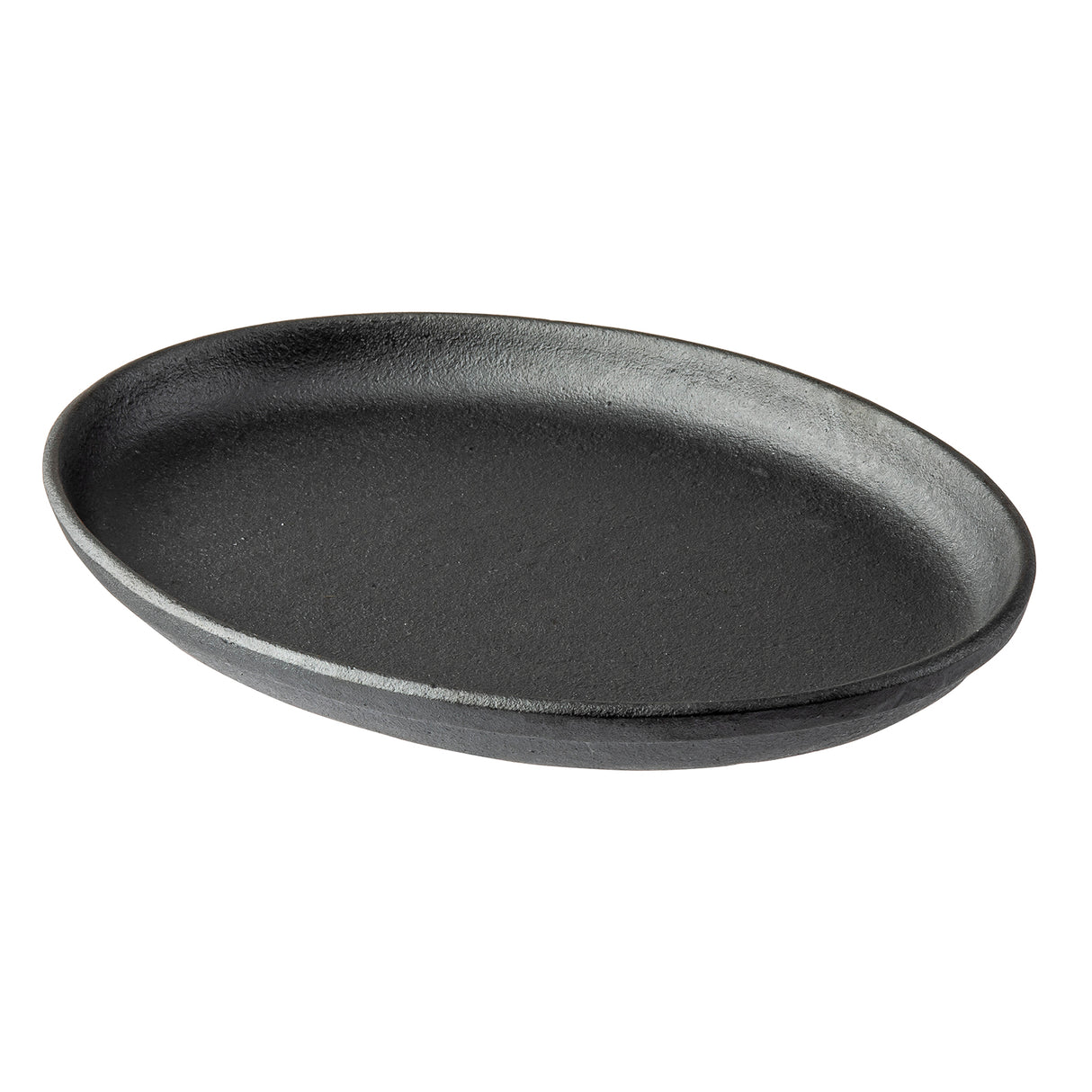 A TableCraft Cast Iron Sizzle Platter, black and oval-shaped with a slightly raised edge, is shown at an angle against a white background. Its matte, textured surface embodies the classic look of quality cast iron cookware.