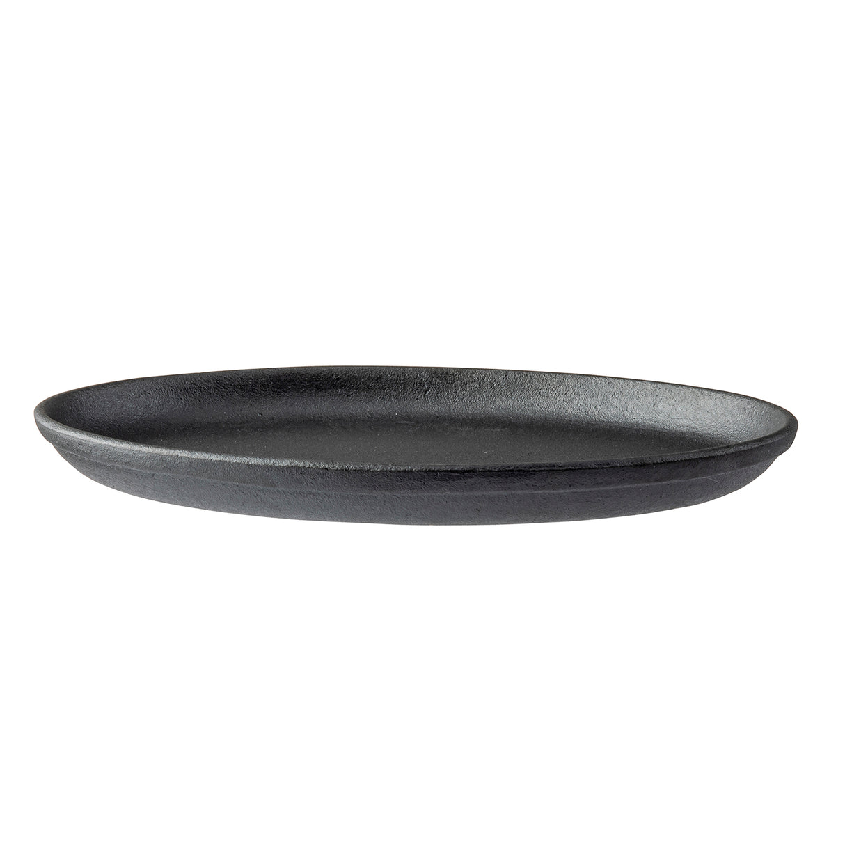 A black, round TableCraft sizzle platter with a matte, textured finish is shown against a white background. The plate has gently curved sides and a flat base, offering a minimalist, modern cast iron-inspired appearance.