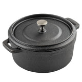 A round, black cast iron Dutch oven, also known as a cocotte, features a textured surface, two side handles, and a fitted lid with a metallic knob. Sturdy and heavy, the pot is ideal for cooking and sits against a white background.