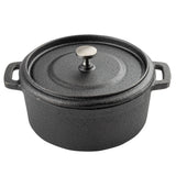 A black cast iron Dutch oven cocotte with a matching lid, round metal knob, and two sturdy handles. The pot features a textured, matte finish and sits on a white background.
