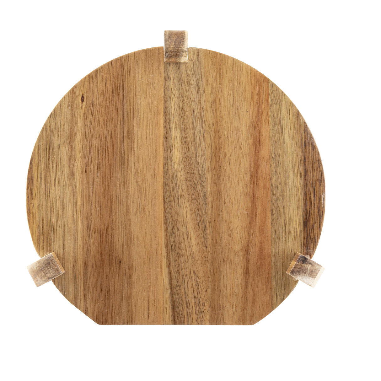 A round acacia wood cutting board with a natural grain pattern is shown against a white background. Three small wooden blocks serve as feet, giving the board a simple, rustic look—perfect as a TableCraft beverage dispenser stand.