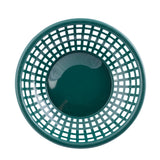 A dark green, round polypropylene serving basket with a grid-like, open-weave pattern viewed from above. The basket has a solid circular base in the center and evenly spaced rectangular holes along the sides. The surface is clean and lighting is bright.