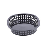 A round, black plastic Chicago Platter Basket with open square grid sides and a solid flat base, set against a white background. Microwave safe and heat resistant, this basket has slightly outward-curving edges and is empty.