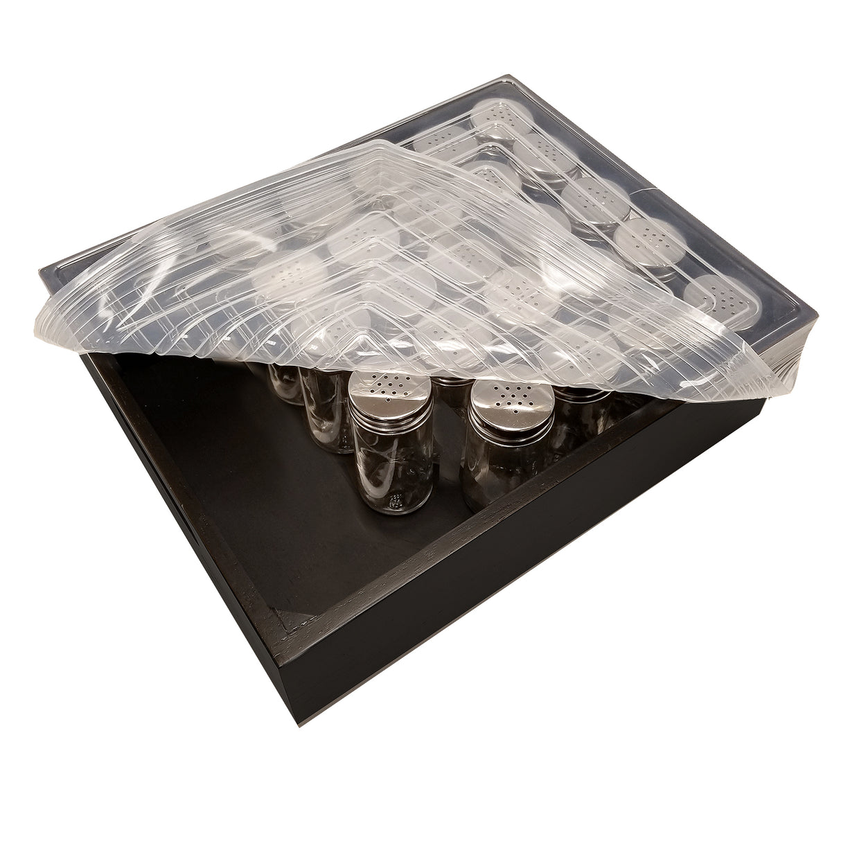 A black tray holds metal salt or pepper shakers arranged in rows, partially covered by a transparent, ridged silicone crate cover lifted at one corner. The image, set against a white background, highlights the organized display inside.