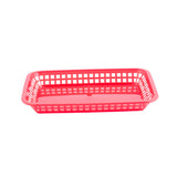 A rectangular, red Más Grande Platter Basket with open grid sides and a solid base, photographed on a white background. The empty basket features slightly rounded corners and is dishwasher safe.
