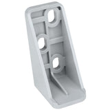 A gray, L-shaped metal door hinge bracket with four circular holes for mounting—two on the vertical face and two on the angled base. Empura Refrigeration parts like this feature ridged reinforcement lines for added strength and smooth, rounded edges.